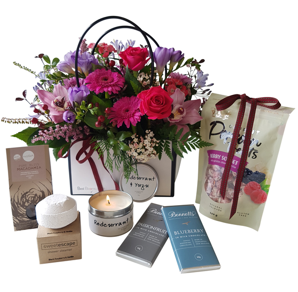 Mother’s Day Gift Ideas in Auckland – Luxury gift hamper with fresh flowers, chocolates, candle, bath treats, and gourmet snacks