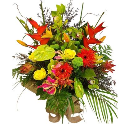Tropical Flowers arranged in a stunning Bouquet with Flax Kete Wrapping