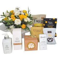 Birthday gift box with fresh flowers, chocolates and a candle, beautifully presented for Auckland delivery.