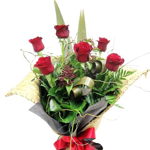 Half%20Dozen%20Red%20Roses%20in%20Flax%20Kete%20Wrap%20with%20Red%20Ribbon.%20Auckland%20Florist., 