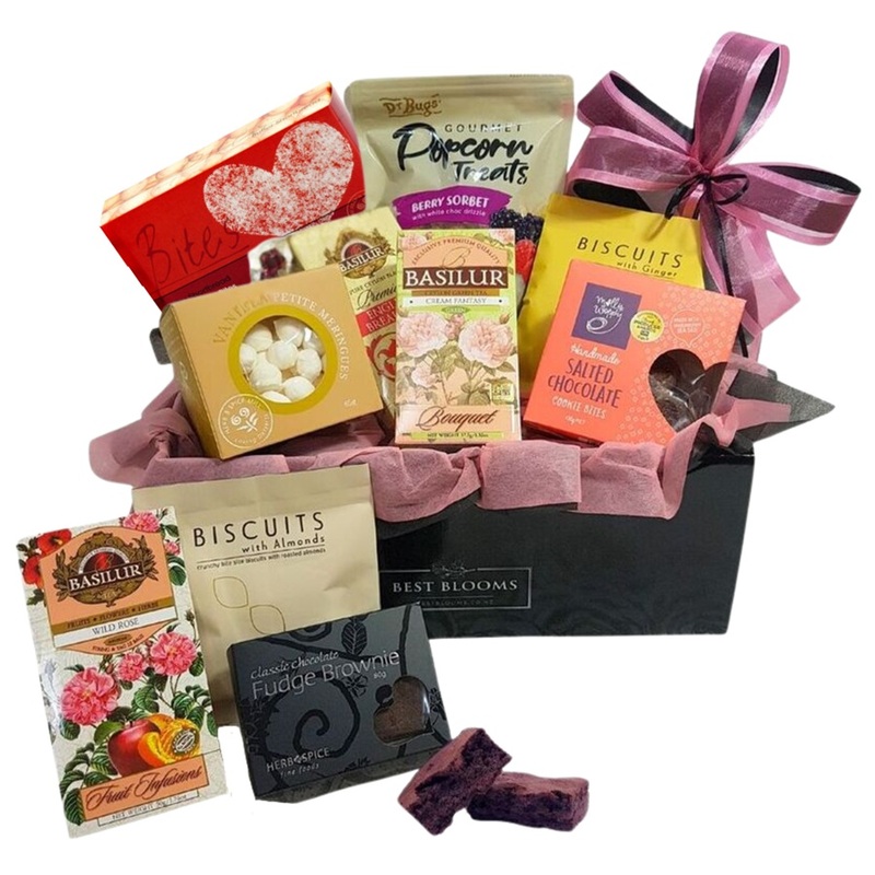 Afternoon Tea Gift Box with pink wrapping, premium teas and NZ biscuits.