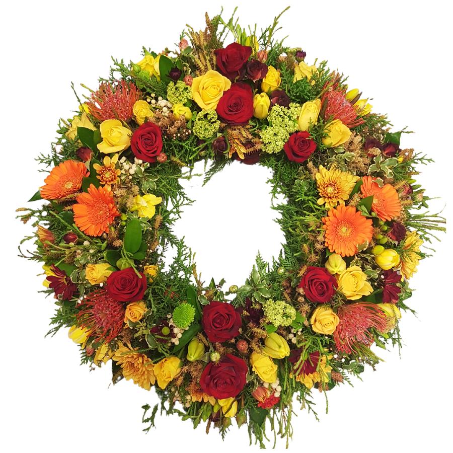 Funeral%20wreath%20for%20a%20Man%20in%20autumn%20colours.%20Reds%2C%20Orange%20flowers%20%26%20Gold%20Seasonal%20Flowers.%20Orange%20roses%2C%20red%20carnations%2C%20Yellow%20chrysanthemums%2C%20leucadendrons., 