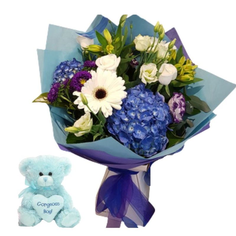 Baby Boy Bouquet and blue baby boy Bunny with long ears.  Flowers in white and blue inc gerberas, roses, chrysanthemums., 