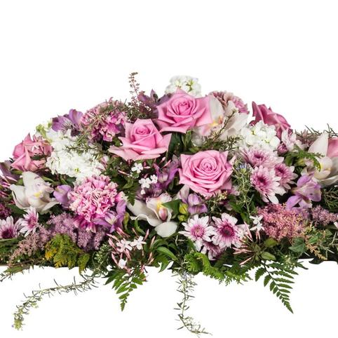 side view mauve pretty casket feminine funeral flowers. Mauve, Lavender and blush pink flowers.