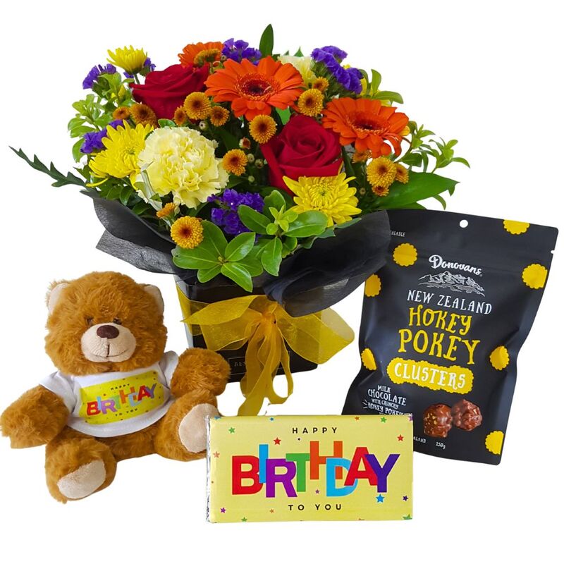 Birthday gift box with flowers, teddy bear and chocolates