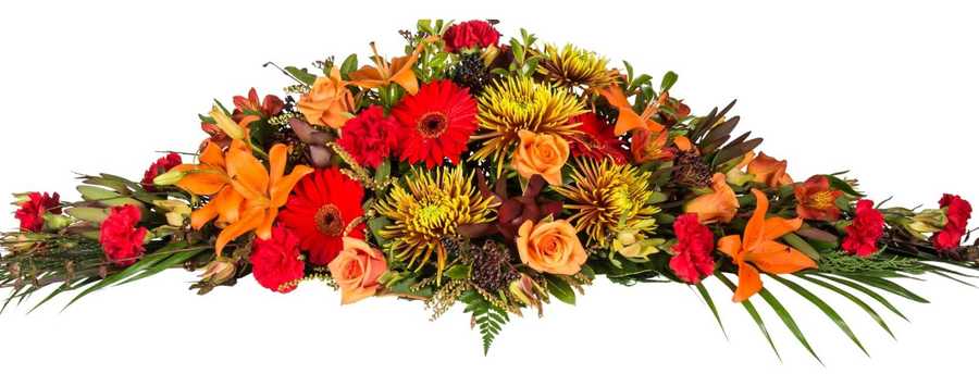 Autumn Casket Spray. Flowers in autumn colours of reds, oranges, golds. Chrysanthemums, Roses, Gerberas, Lillies, Alstroemarias.