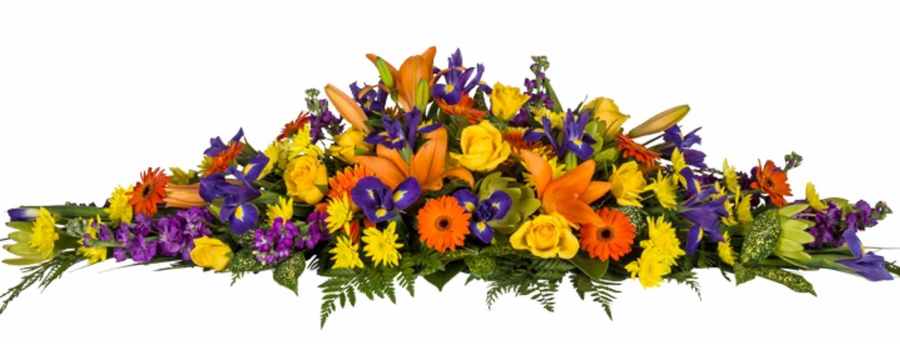 Bright Colourful Casket Spray Flowers. Mixed seasonal bloom, iris, lilies, yellow roses, orange gerberas. Auckland Florist., 