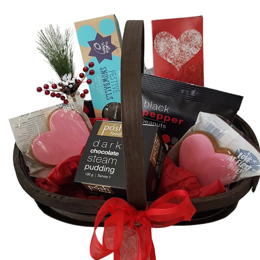 Rustic wood rug basket filled with New Zealand made Christmas treats and a cute wee table-top arrangement.