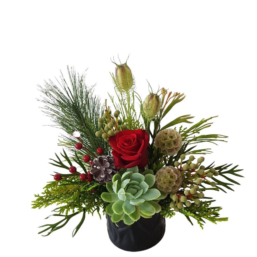 Christmas table top arrangement in ceramic pot