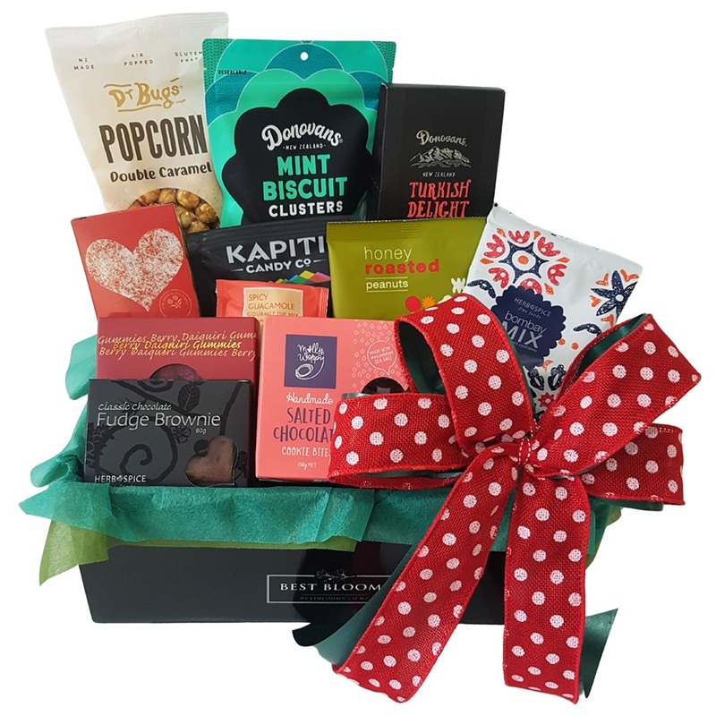 Merry Christmas gift basket with festive treats and gourmet snacks