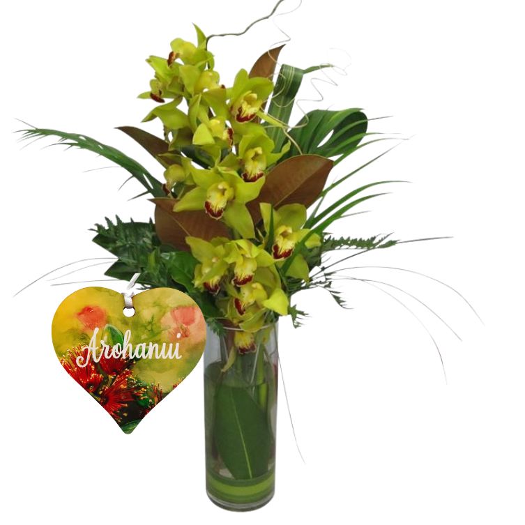 green orchid in glass vase