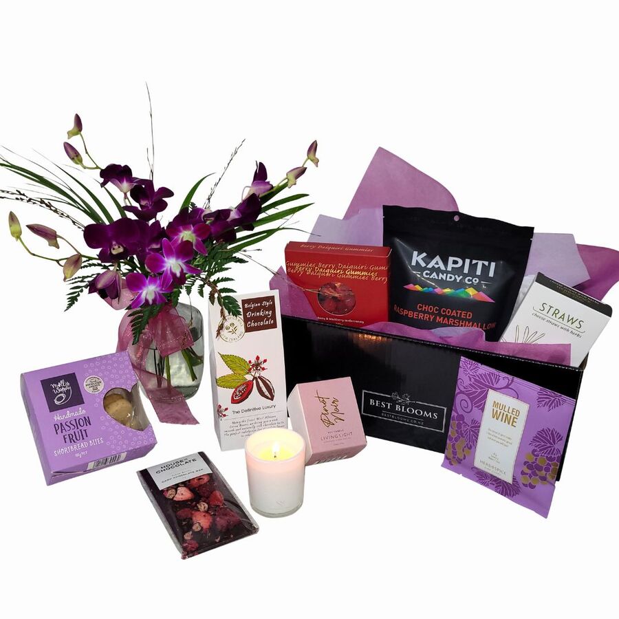 Close up of Pinot Noir Candle, Hot Chocolate, Cookies and Gifts included in Cosy Nights Hamper.