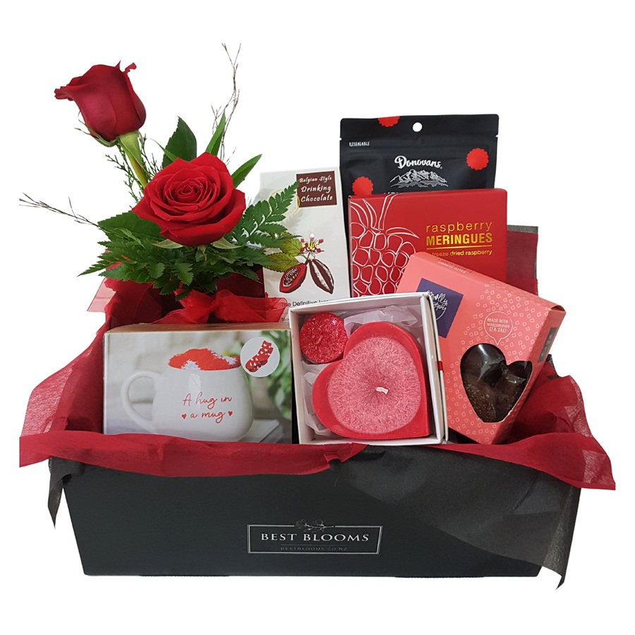 Close up of Pinot Noir Candle, Hot Chocolate, Cookies and Gifts included in Cosy Nights Hamper.