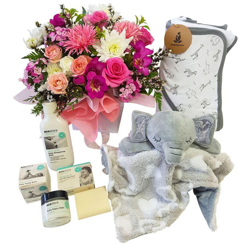 New Baby Girl Bathing gift basket with flowers, hooded towel, teddy baby cuddly, and baby clothes