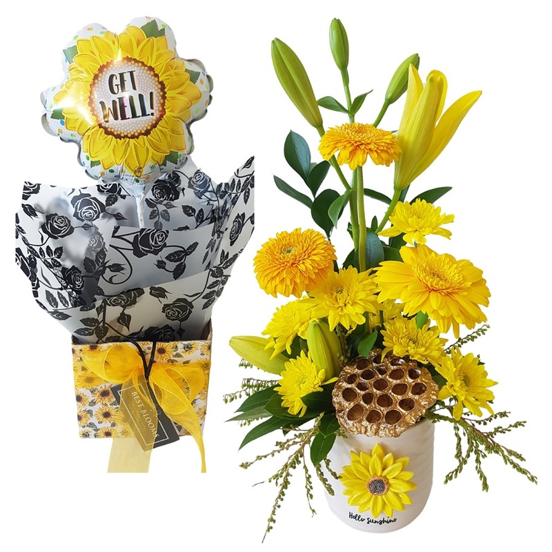 yellow potted flowers with sunflower balloon