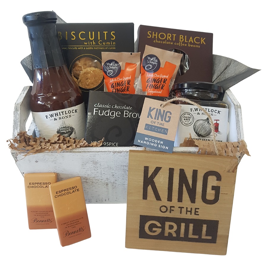 wooden crate of barbecue condiments and tasty treats