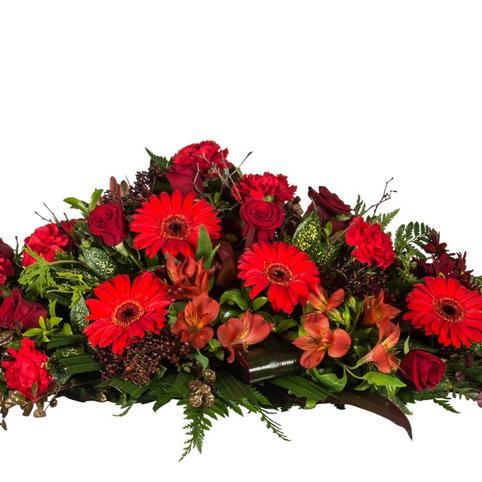 red flowers funeral casket spray