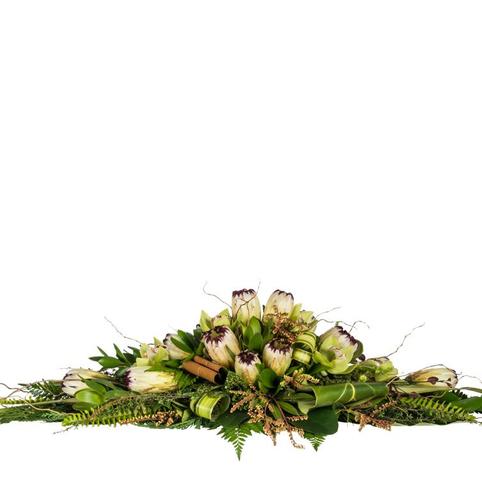 casket spray of proteas and twigs masculine style
