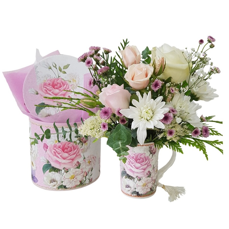 Fresh flower posy in a china mug for Mum