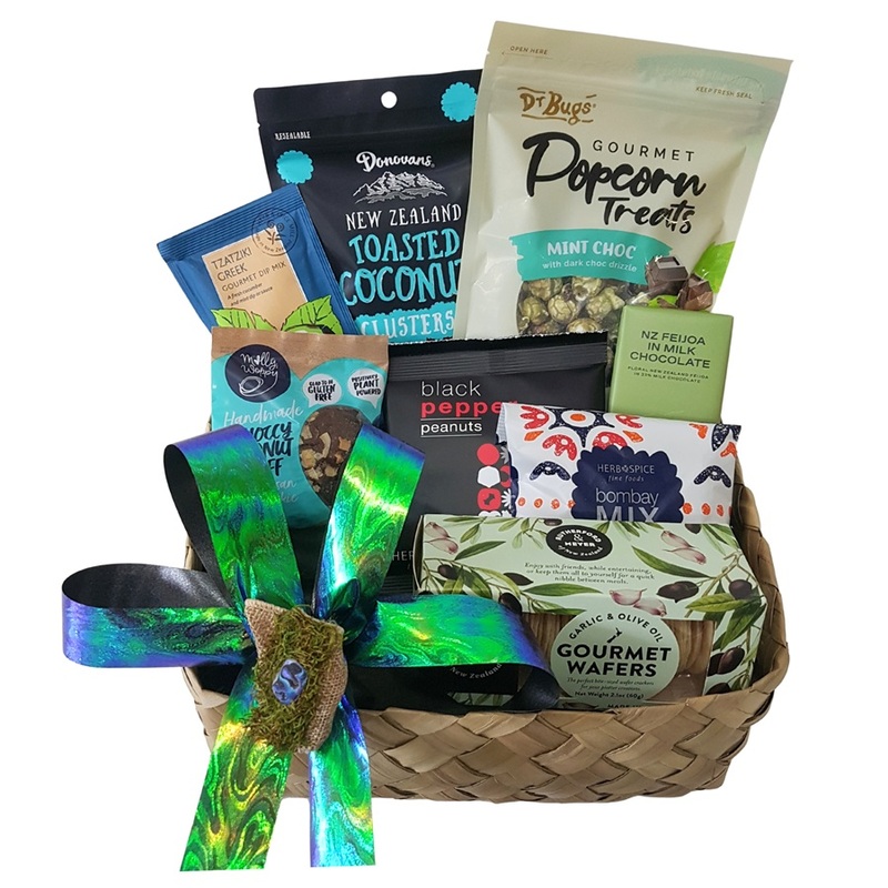 NZ Paua Shell Kete Basket filled with New Zealand made chocolates, popcorn, crackers and treats.