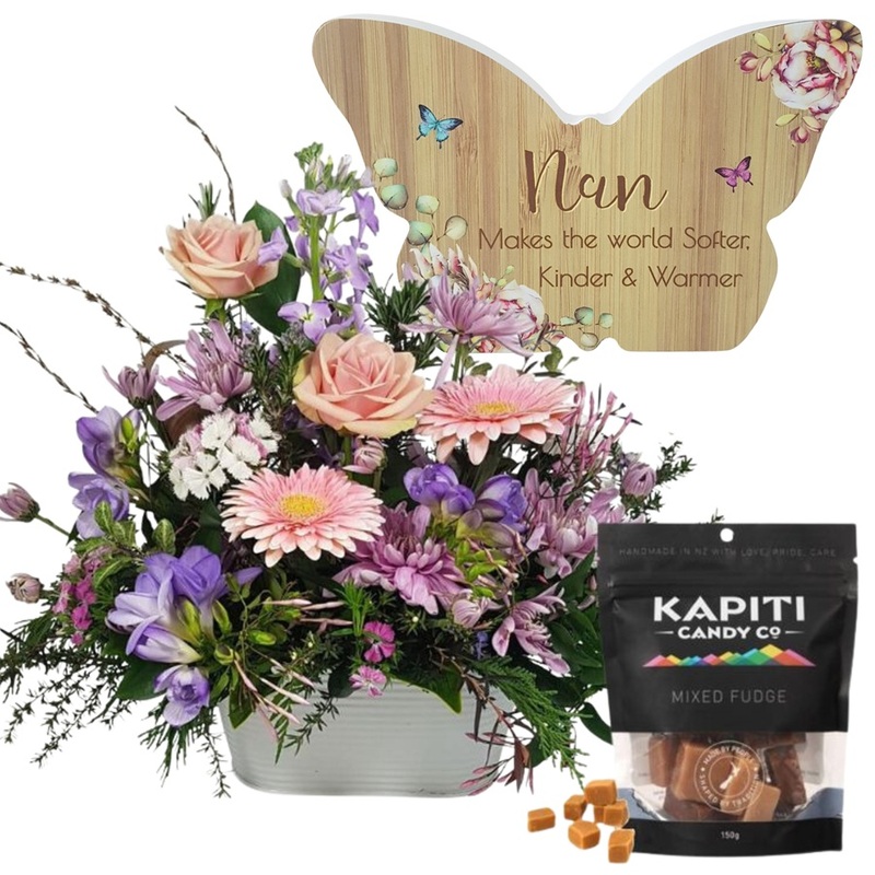 Pastel flower arrangement for Nana with butterfly keepsake and fudge in tin trough