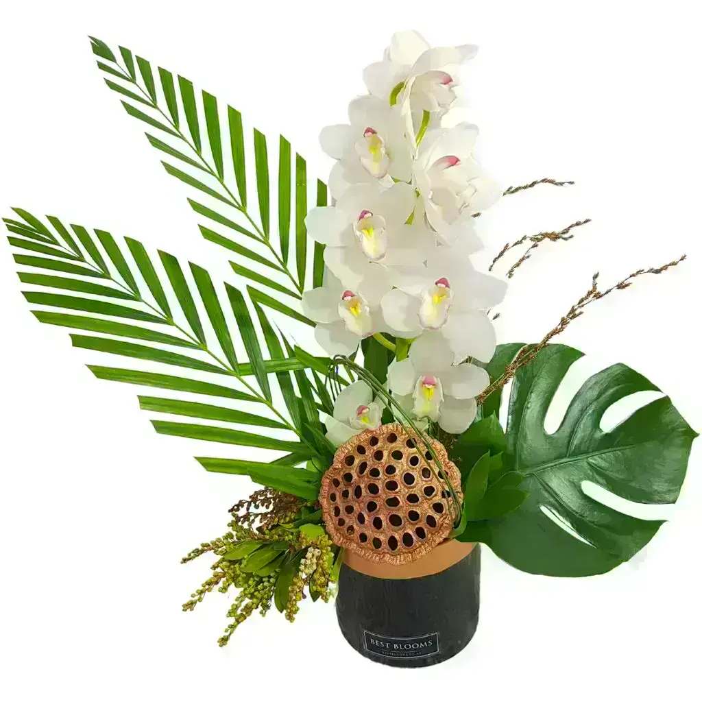 Green Cymbidium orchid arrangement with tropical palm leaves