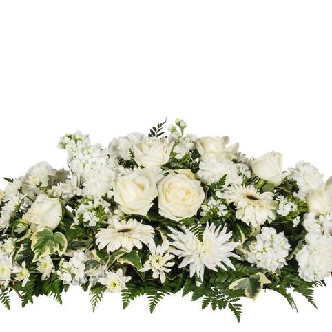 side view showing selection of white flowers used in casket spray