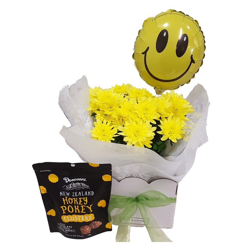 chrysanthemum plant in gift box with smiley face balloon and hokey pokey chocolates
