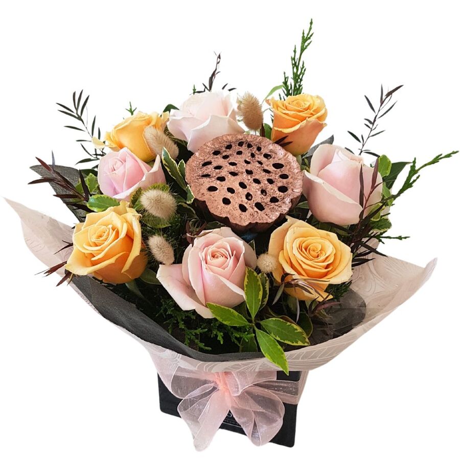 Mothers Day Arrangment of Pink Roses and Peach Roses with Lotus Po and Bunnytails in smart Black Gift Box