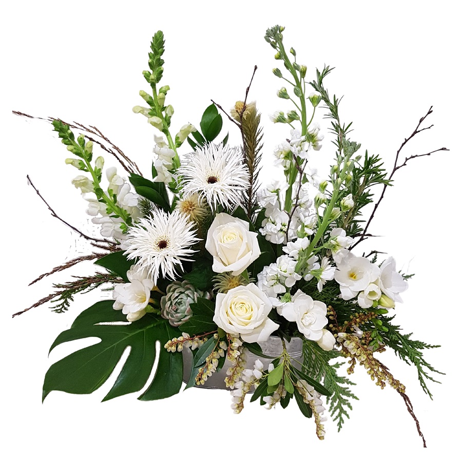 stylish white florals in tin trough filled with seasonal blooms such as roses, gerberas, chrysanthemums and foliages