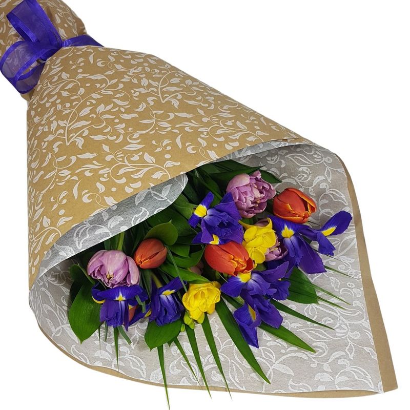 bunch of spring flowers iris, tulips, daffodils with fresh greenery in a stylish cone wrap. Flowers delivered Auckland NZ.