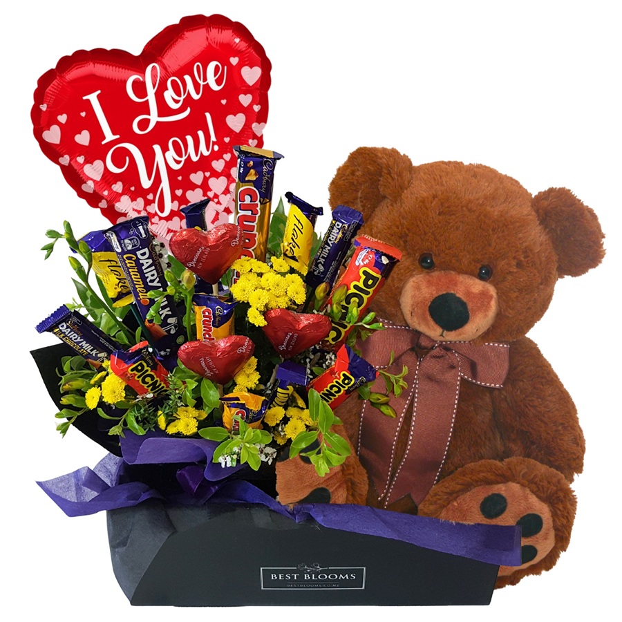Teddy Loves Chocolate Box Teddy Loves Chocolate – chocolate bouquet with large teddy bear and I Love You balloon, hand-delivered across Auckland.