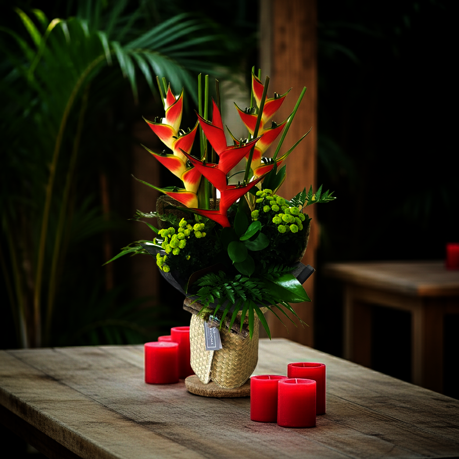 Lifestyle Image Tropical Bouquet on Rustic Wooden Table with Red Candles