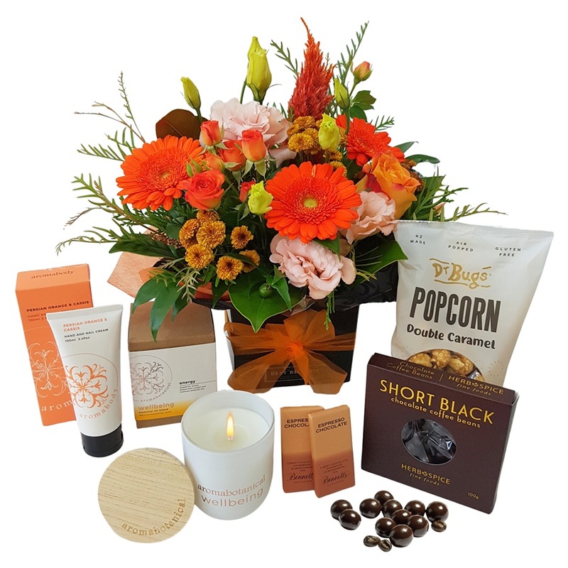 Wellbeing gift hamper with aromatherapy candle, fresh flowers and gourmet treats