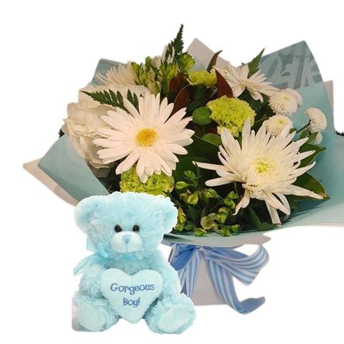 Baby Boy Bouquet and blue baby boy Teddy.  Flowers in white inc gerberas, roses, chrysanthemums.