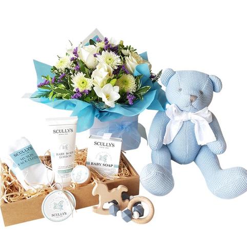 Baby Boy Blue Gift Hamper delivered auckland includes cotton knit teddy bear and flowers, and scullywags baby care products.