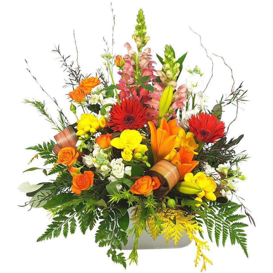 bright cheerful flowers arranged in box style trough.