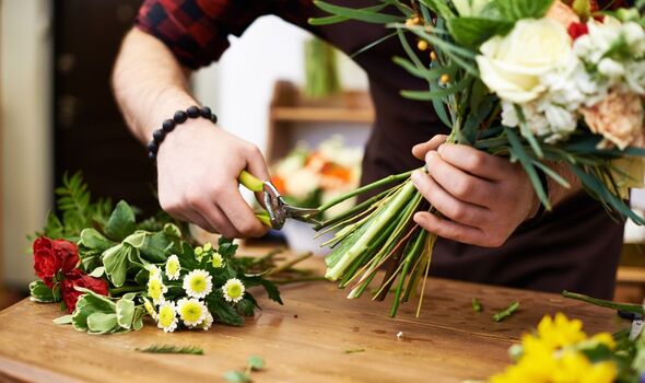 Florist making a bouquet at Best Blooms