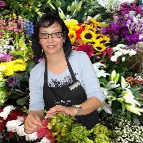Deal of the Day flowers florist choice flowers made in your colour choice and include favourite flowers. Picture shows Donna our senior florist with a full flower shop of fresh flowers behind her.