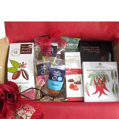 close up of hot chocolate, cookies and cup included in gift hamper