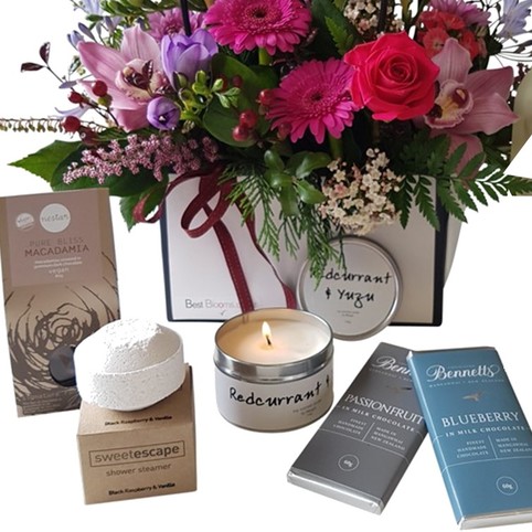 Berry Bliss Gift Package close up of shower steamer, macadamias and chocolates in gift package.