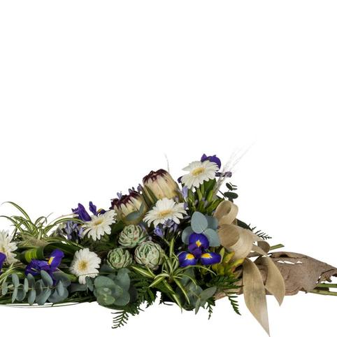 Coastal Breeze Natural Funeral Spray close up showing succulents, protea, iris and gerbera flowers
