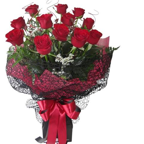 12 Red Valentines Roses Auckland delivery in stylish black lace wrap and red satin ribbon bow