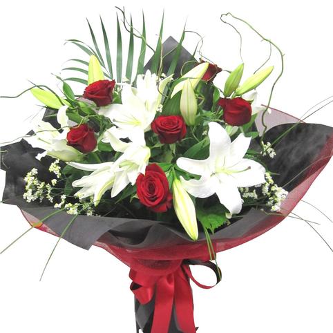 Lilies and roses together in a bouquet wrapped in black and red. Stylish bouquet. Same day delivery Auckland