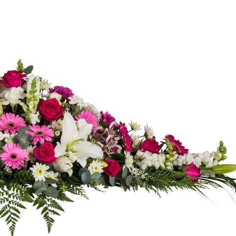 side view of pink and white casket spray florals
