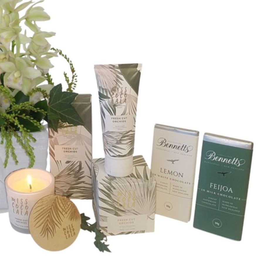 gift package featuring orchids, chocolates, candle, hand cream auckland