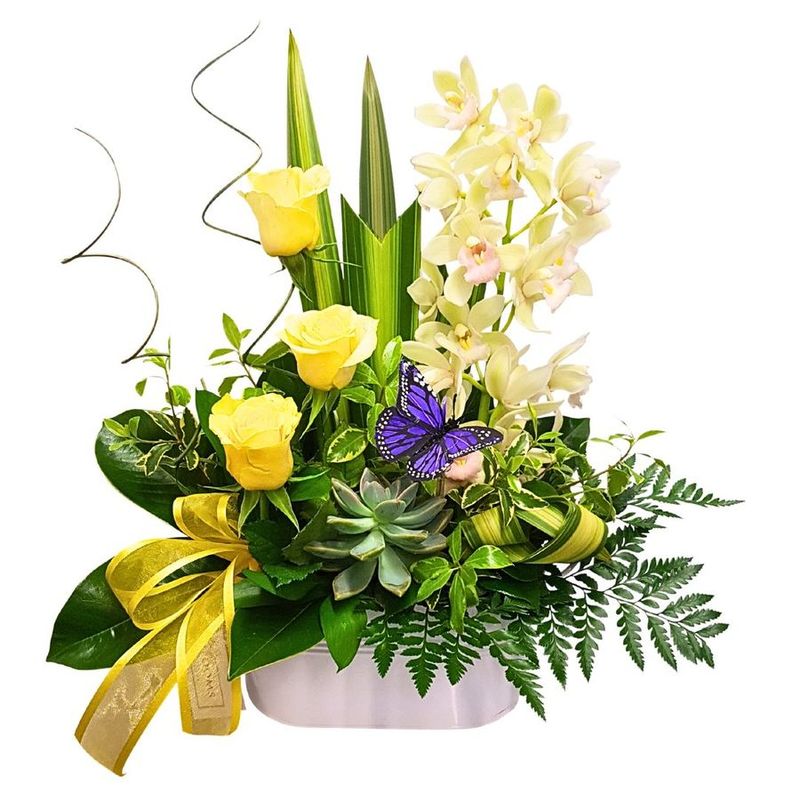 orchids and roses in floral arrangement with butterfly