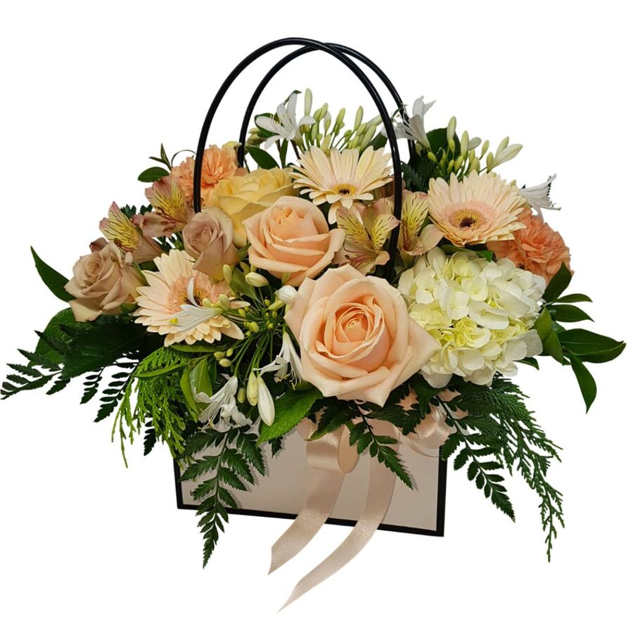 gift of peach flowers arranged in handbag auckland