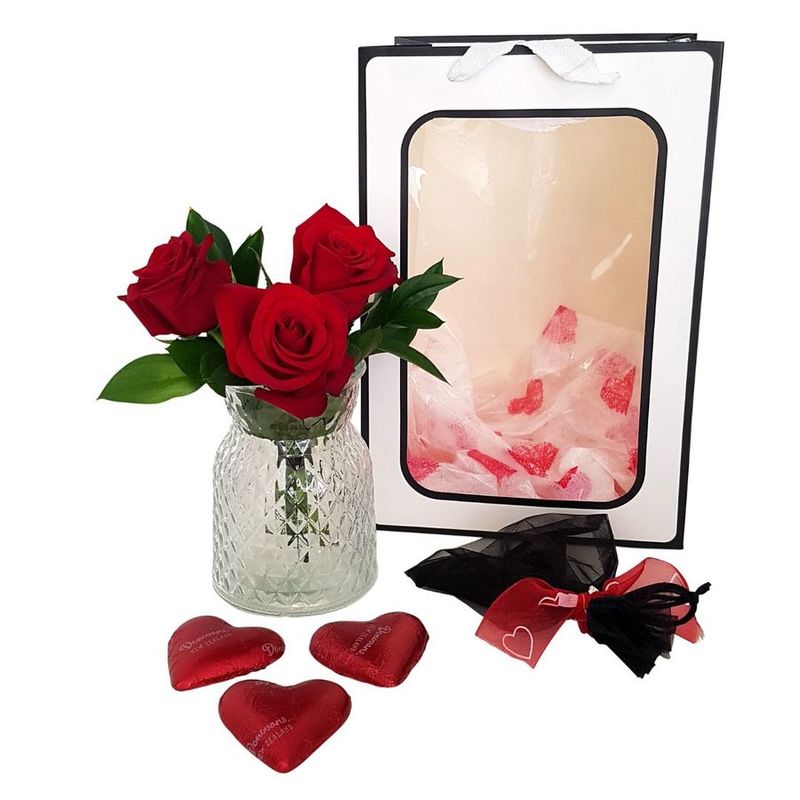 valentines day 3 red roses in vase and black gift bag with cherry chocolates in heart tin, 