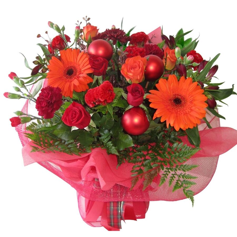 rich lush christmas bouquet in red and orange flowers